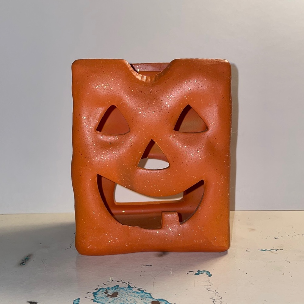 Ceramic pumpkin tea light candle holder.